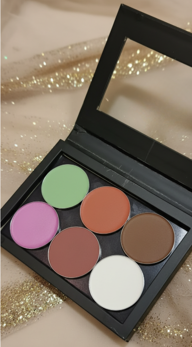 Makeup palette with six colors on a glittery background